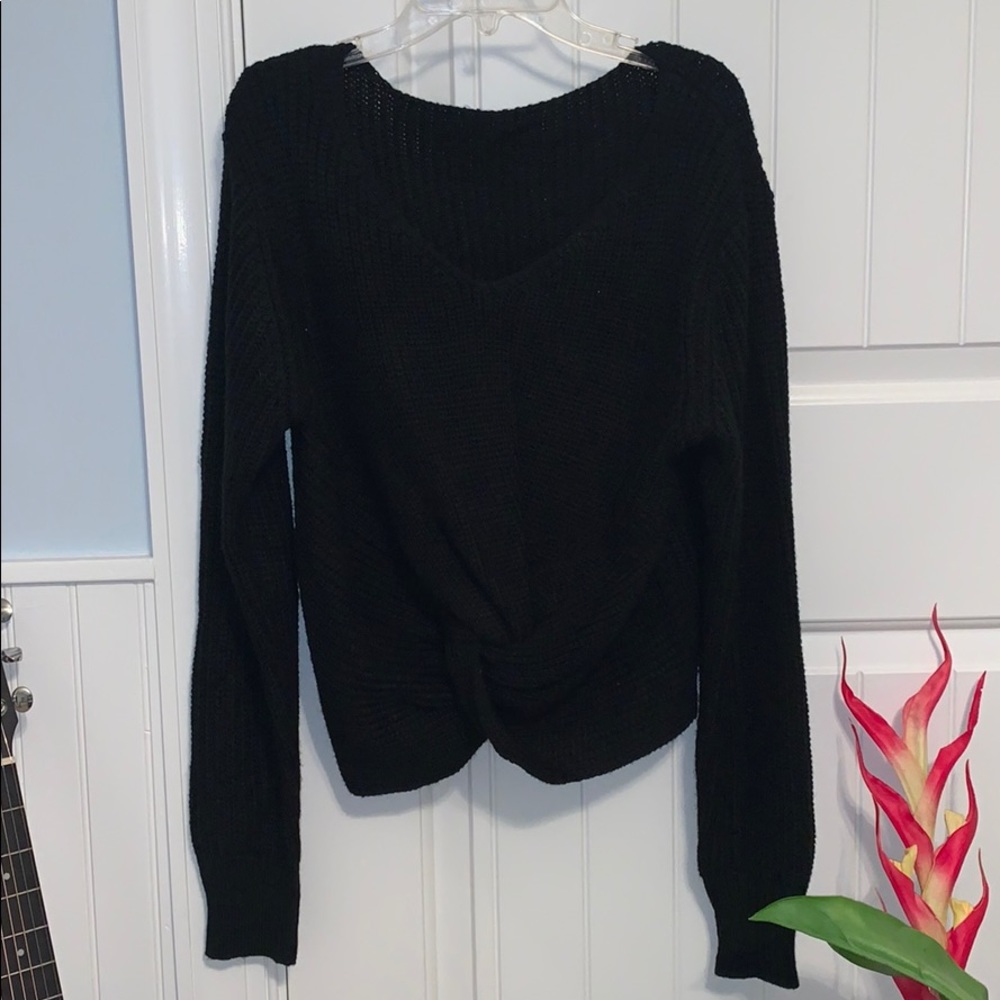 knotted black sweater